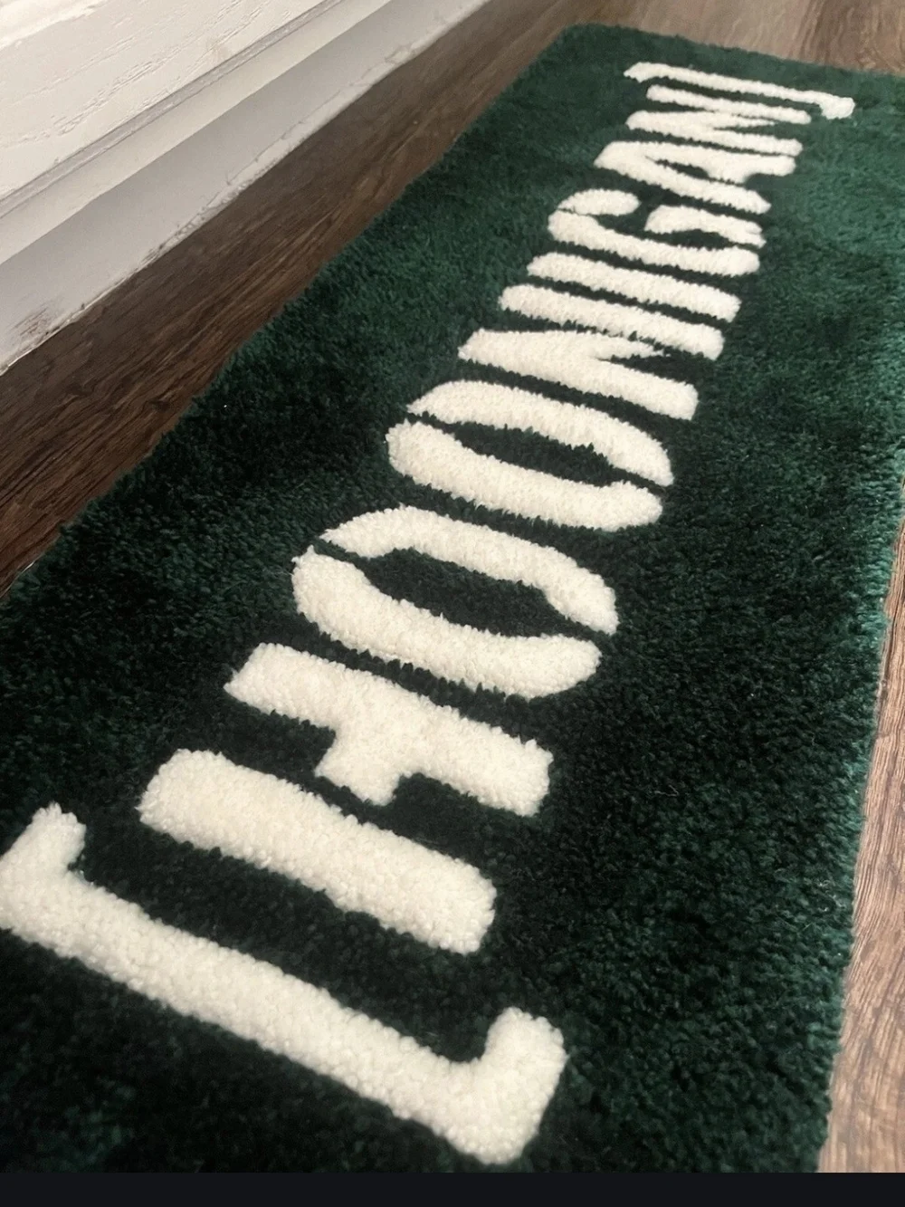Green and White Logo Accent Rug